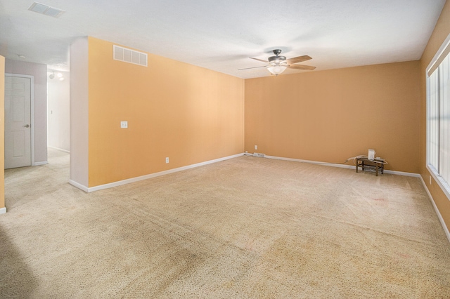 carpeted empty room with ceiling fan