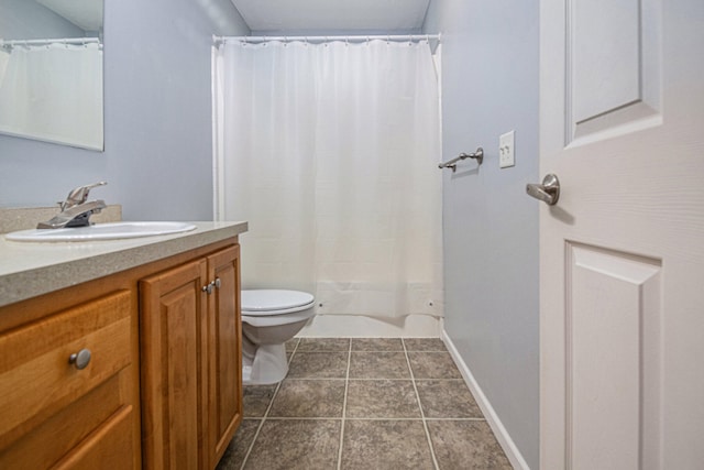 bathroom featuring tile patterned flooring, vanity, a shower with shower curtain, and toilet