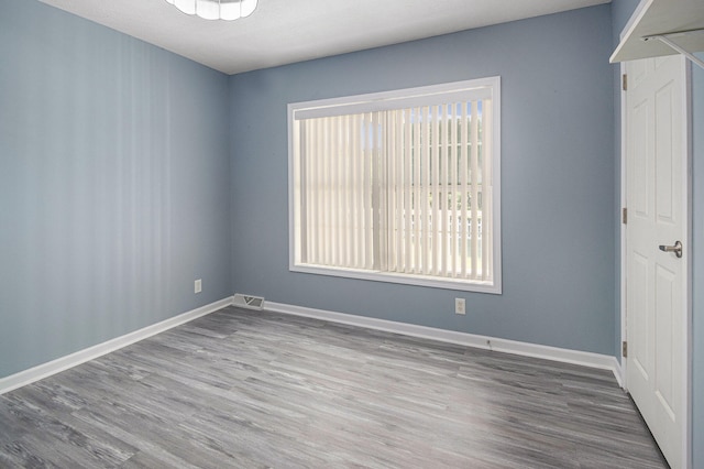 empty room featuring hardwood / wood-style floors