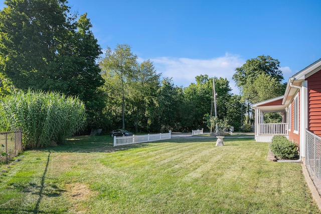 view of yard featuring covered porch