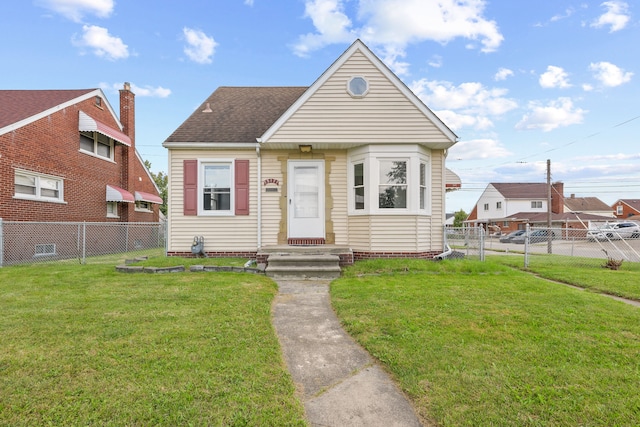 bungalow-style home with a front yard