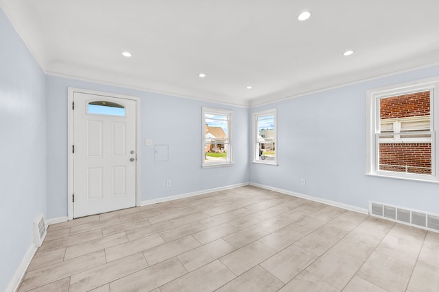 interior space with a wealth of natural light and crown molding