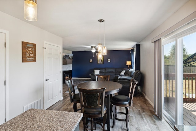 dining area featuring wood-type flooring