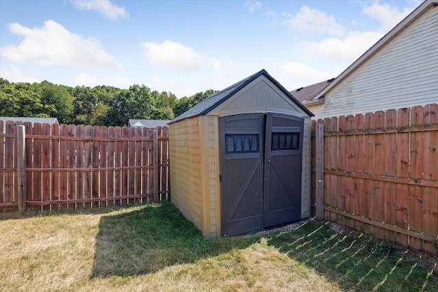 view of outdoor structure featuring a lawn