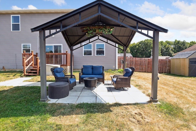 view of patio featuring an outdoor hangout area, a gazebo, and a storage shed