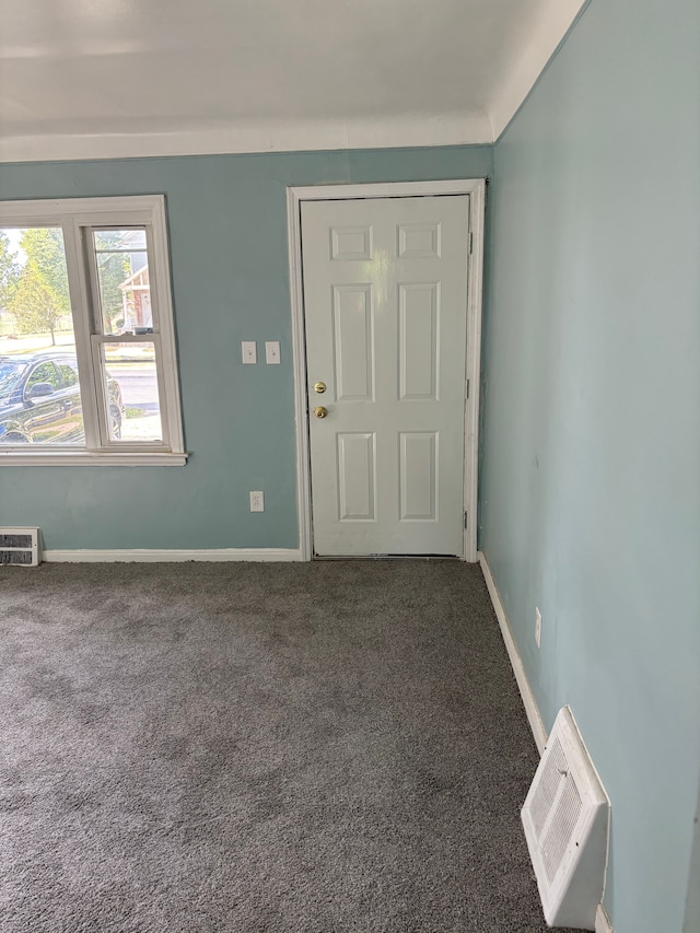 view of carpeted entrance foyer