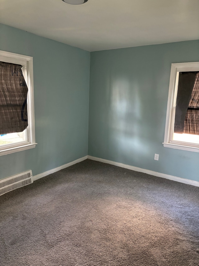 unfurnished room with carpet flooring