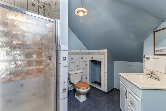 bathroom with tile patterned flooring, toilet, lofted ceiling, and walk in shower