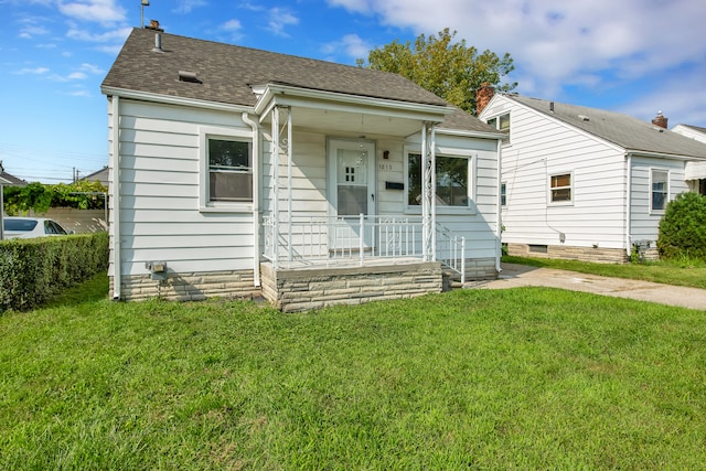 bungalow-style house with covered porch and a front yard