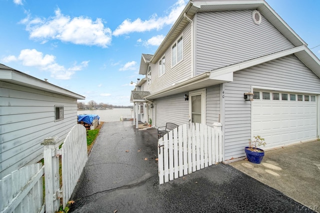 view of side of property with a garage