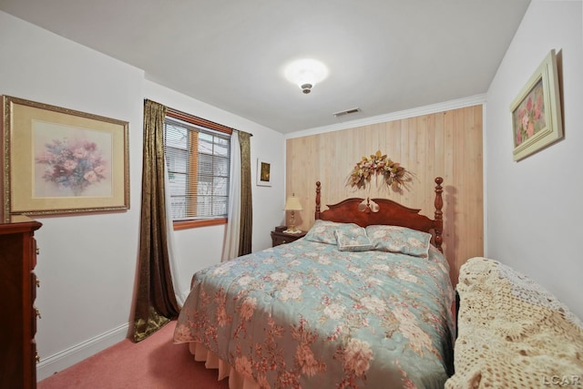 carpeted bedroom featuring crown molding