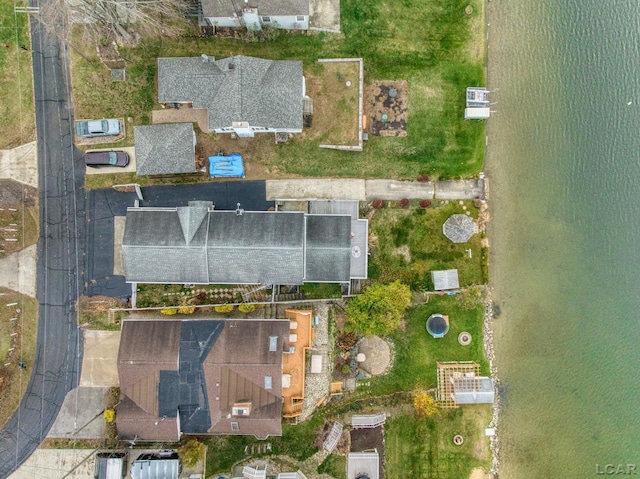 bird's eye view with a water view