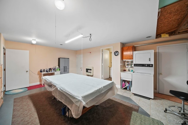 playroom with heating unit, pool table, and stacked washer and clothes dryer