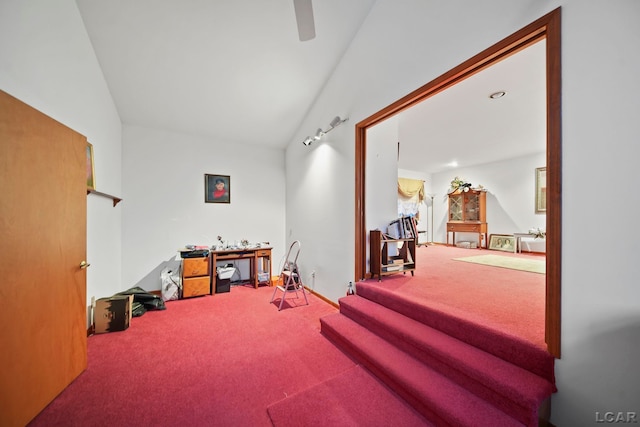 interior space with carpet flooring and vaulted ceiling