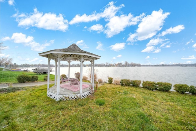 view of yard featuring a gazebo and a water view