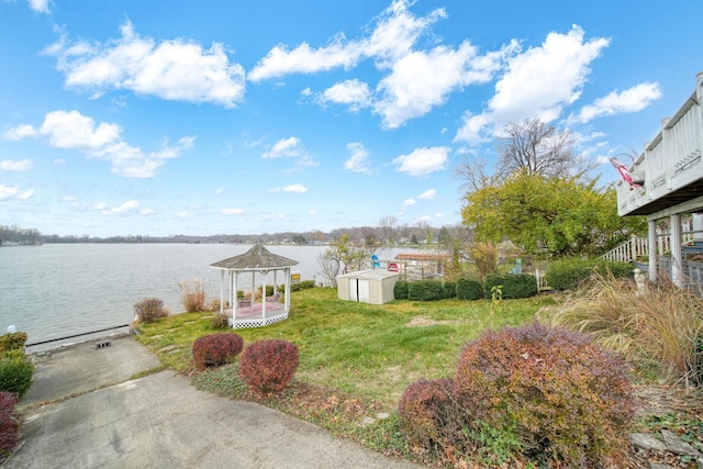 view of yard featuring a gazebo and a water view