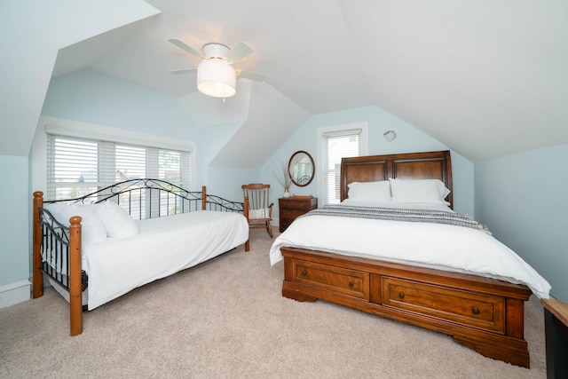 carpeted bedroom featuring vaulted ceiling and ceiling fan