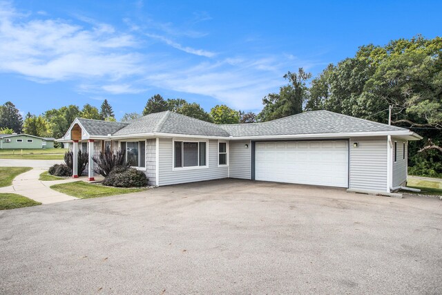 single story home with a garage