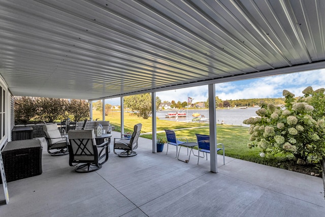 view of patio / terrace with outdoor lounge area and a water view