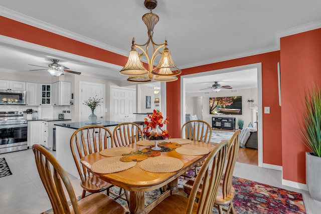 dining room with light hardwood / wood-style flooring, ceiling fan, and crown molding