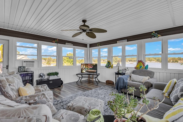 sunroom featuring ceiling fan and plenty of natural light