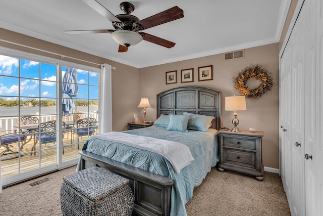 bedroom with ceiling fan, light carpet, access to outside, and a closet