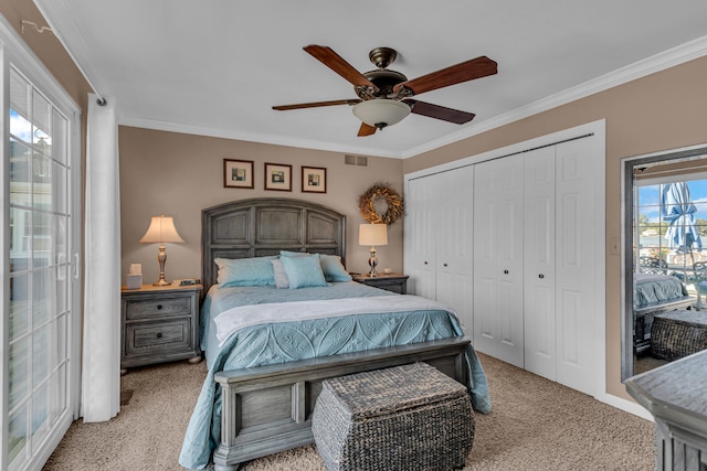 carpeted bedroom with access to outside, a closet, ceiling fan, and crown molding