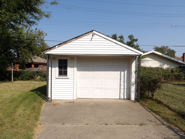 garage featuring a yard