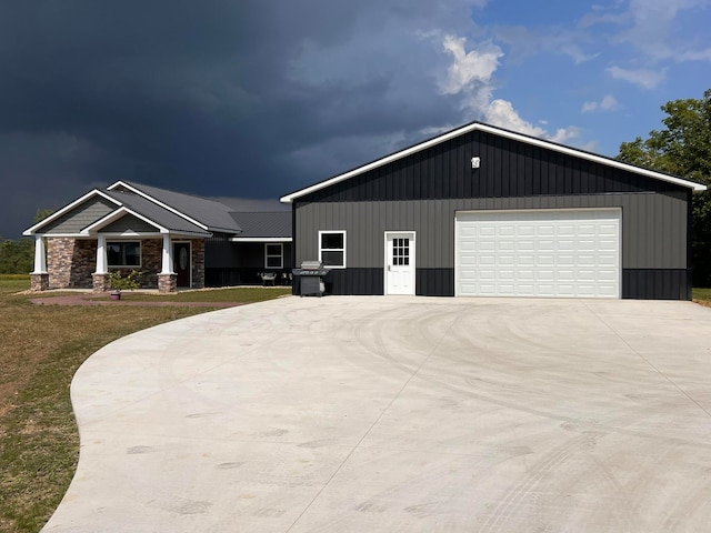 view of front of property with a front yard and a garage