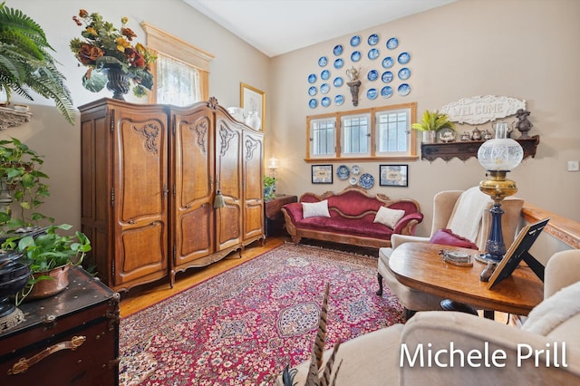 living area with hardwood / wood-style flooring