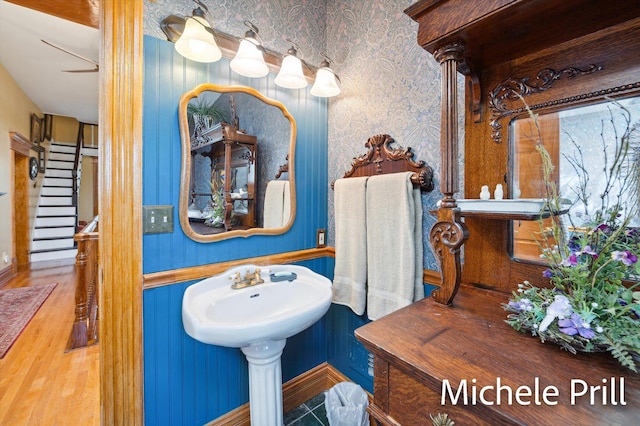 bathroom featuring wood-type flooring and ceiling fan