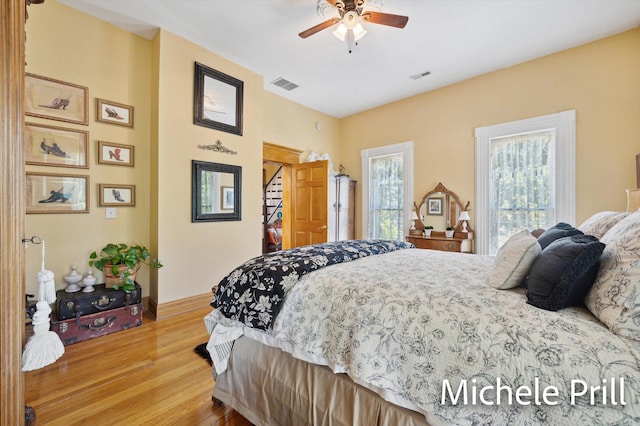 bedroom with hardwood / wood-style flooring and ceiling fan