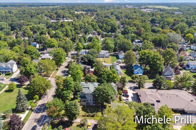 118 E Oliver St, Owosso, MI 48867 - aerial view of residential area featuring a forest