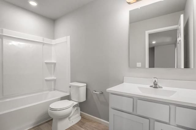 full bathroom featuring vanity, shower / bathing tub combination, wood-type flooring, and toilet