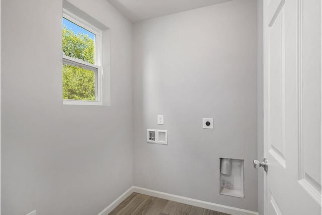 washroom featuring washer hookup, electric dryer hookup, and wood-type flooring