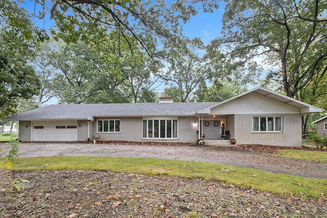 single story home featuring a garage