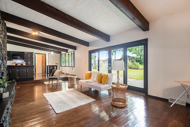 living room with vaulted ceiling with beams, dark hardwood / wood-style flooring, and french doors