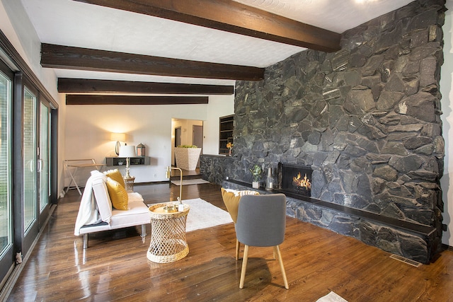 living room featuring plenty of natural light and dark wood-type flooring