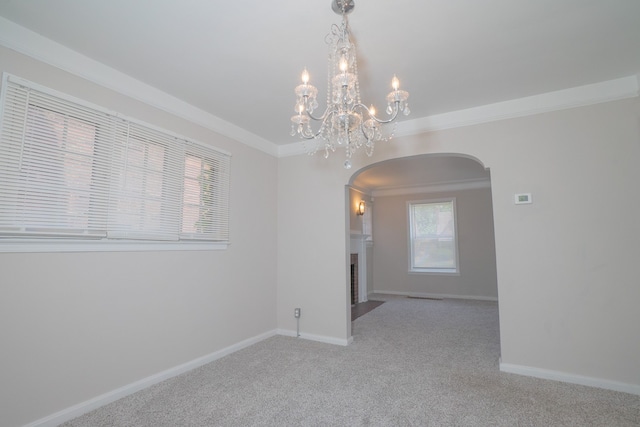 carpeted spare room with ornamental molding