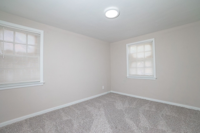 unfurnished room with carpet floors