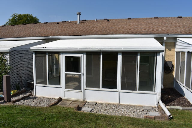 rear view of house with a sunroom