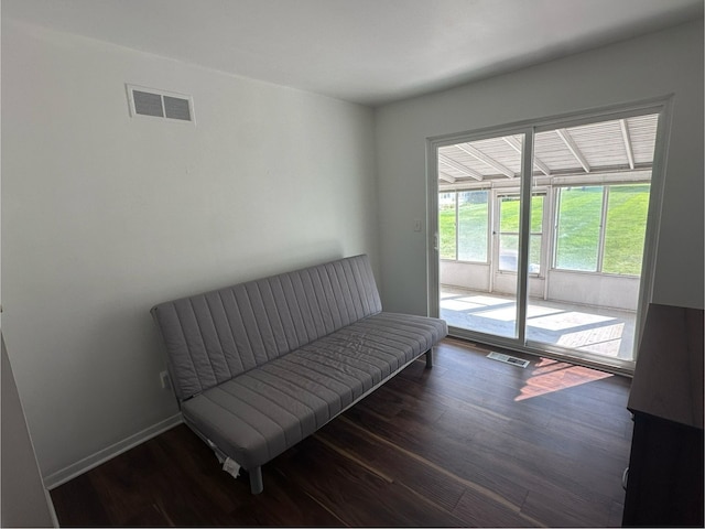 sitting room with dark hardwood / wood-style flooring