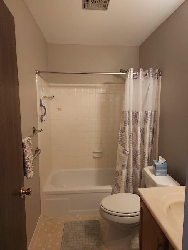 full bathroom with shower / bathtub combination with curtain, tile patterned floors, vanity, and toilet