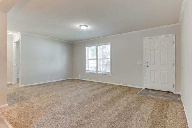 unfurnished room featuring light colored carpet and ornamental molding