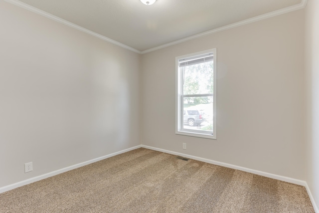 carpeted empty room featuring ornamental molding