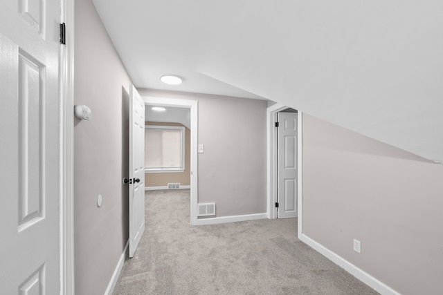 corridor with light colored carpet