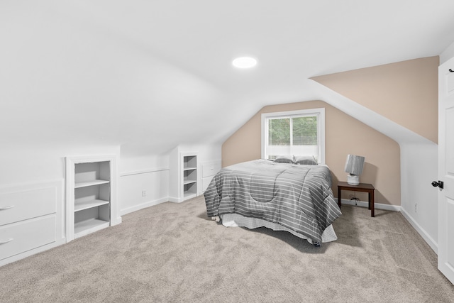 carpeted bedroom featuring vaulted ceiling