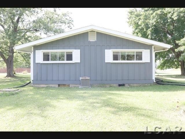 view of home's exterior with a yard