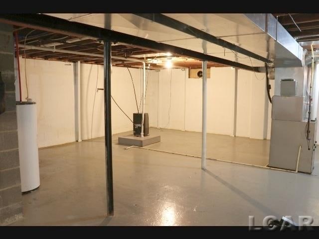 basement with heating unit and water heater