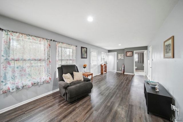 sitting room featuring recessed lighting, baseboards, and dark wood-style floors